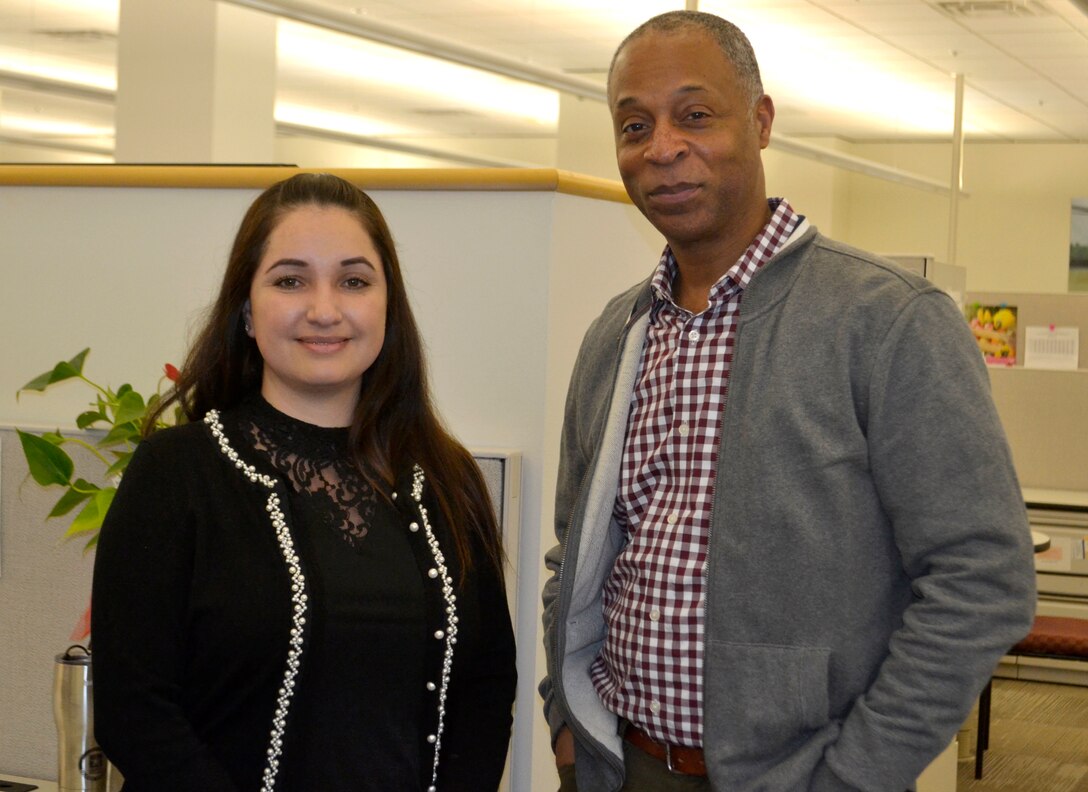 Gabriela Moraga, a Medical tailored vendor logistics specialist, left, and Peter Skillings, Medical’s Collective and Foreign Military Sales branch chief, right, pose for a photo at DLA Troop Support March 13, 2020 in Philadelphia.