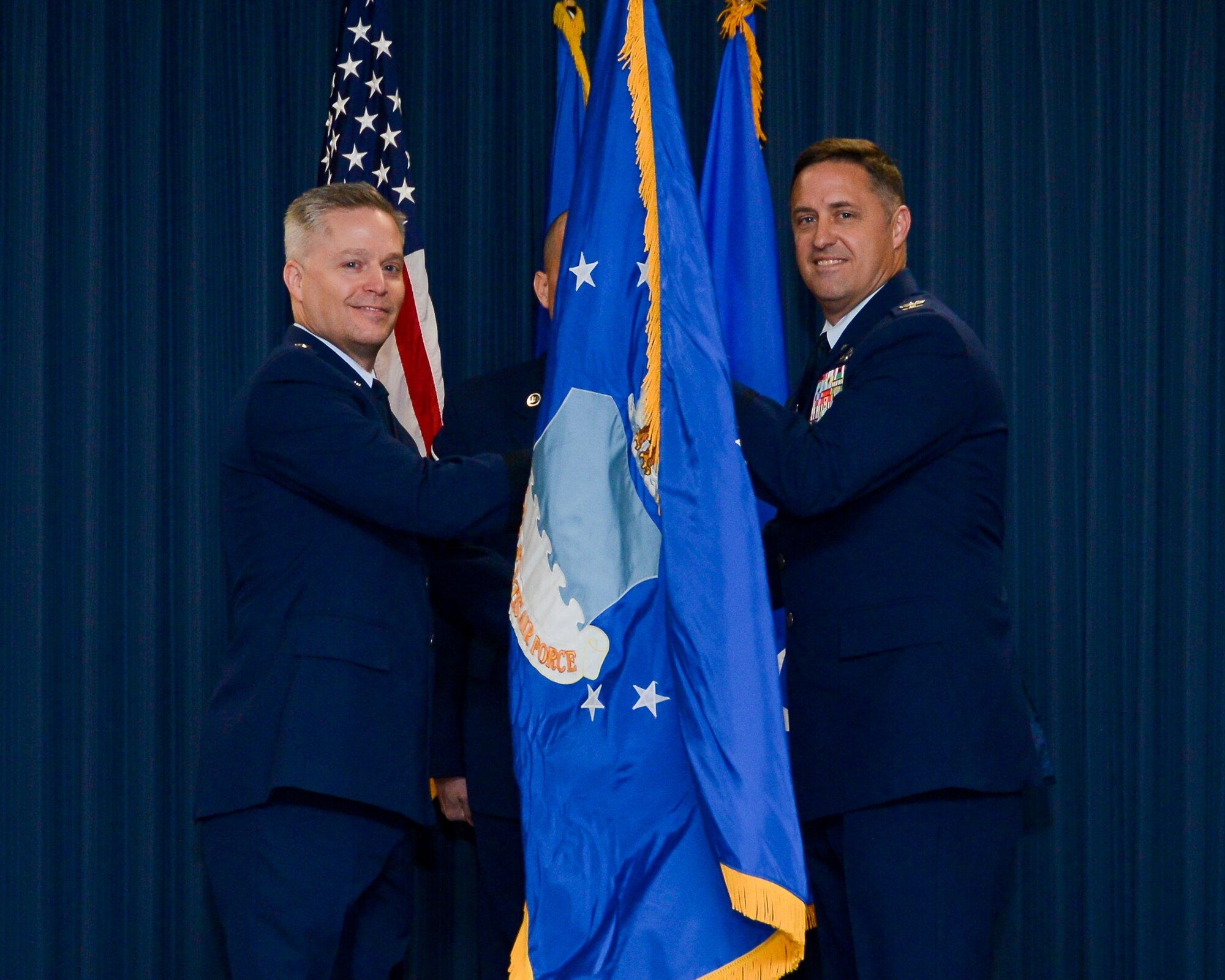 U.S. Air Force Col. James F. Weaver (right) assumes command of the 616th Operations Center from Lt. Gen. Timothy Haugh, Sixteenth Air Force (Air Forces Cyber) commander, during the 616th OC activation ceremony at Joint Base San Antonio-Lackland, Texas, Monday, March 16, 2020.  The new warfighting unit will be responsible for the convergence of the Air Force information warfare enterprise to create new outcomes for the nation.  (U.S. Air Force photo by Sharon Singleton)