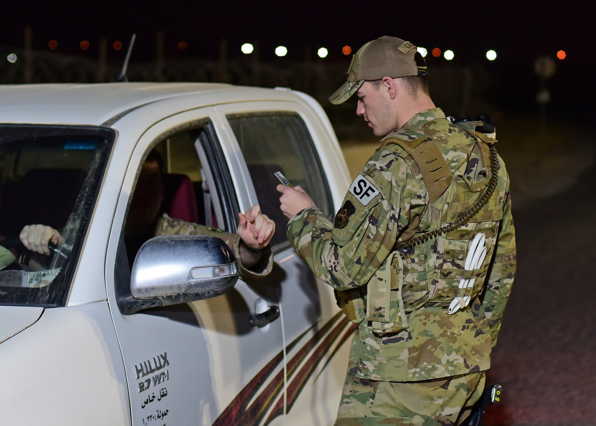 Airman checks visitor ID