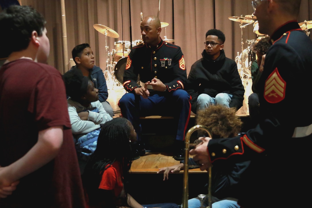 U.S. Marines from the 2nd Marine Division Brass Band play a concert with students from Greensboro, North Carolina March 2, 2020. After playing the concert, the Marine musicians mentored the music students, and discussed opportunities to pursue their musical careers in the Marine Corps. (U.S. Marine Corps photo by Sgt. Jacob Colvin)