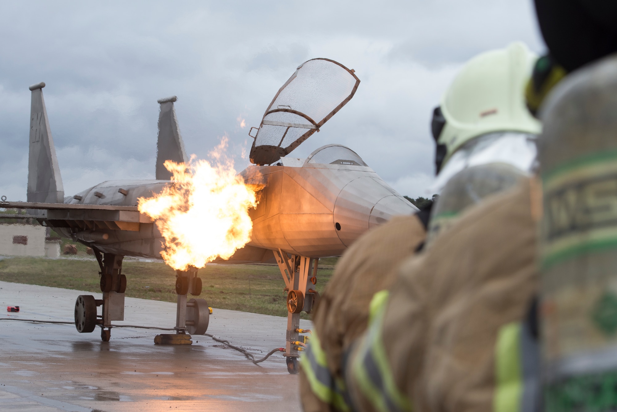 Photo of firefighters preparing to extinguish fires.