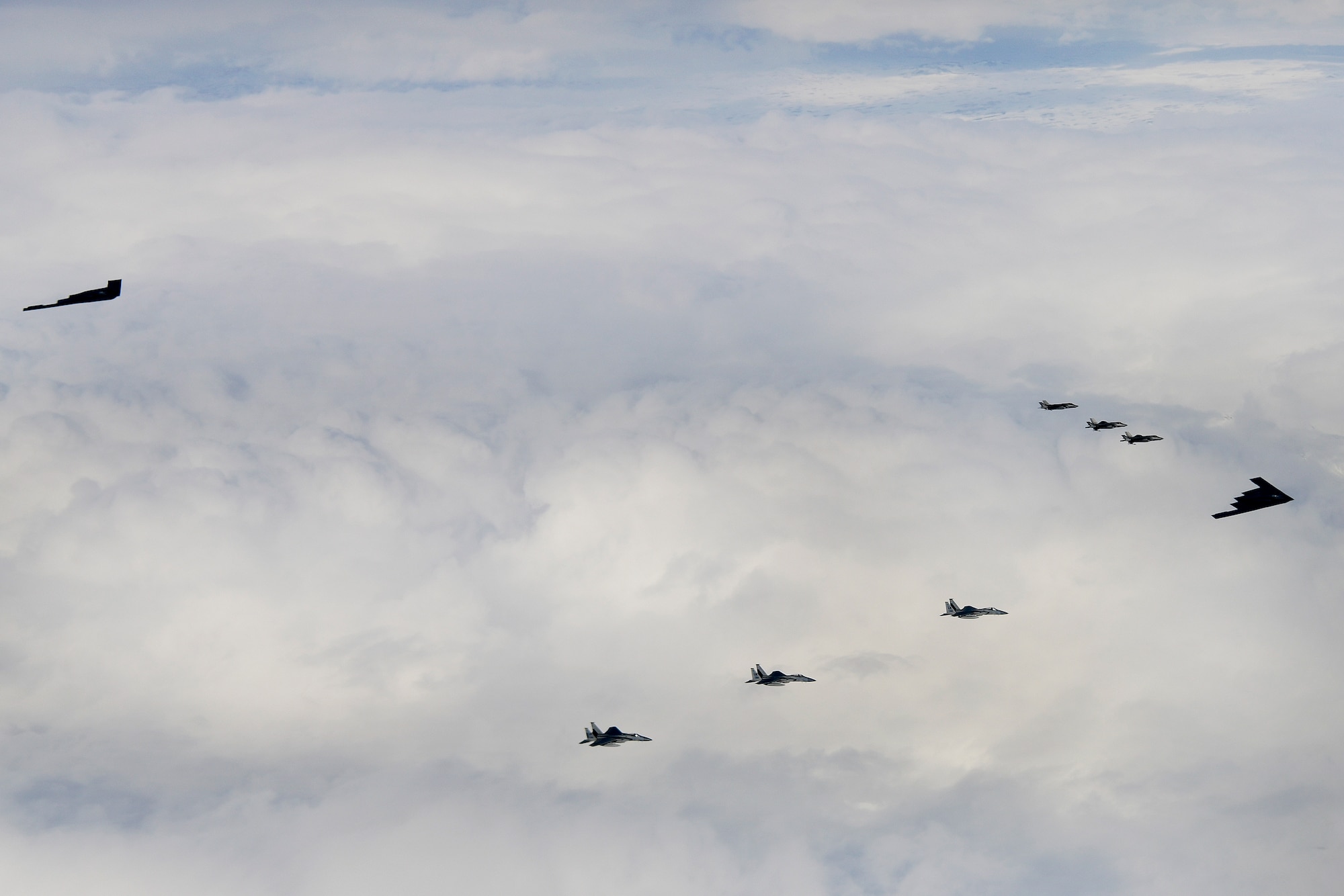 B-2A Spirit bombers assigned to the 509th Bomb Wing, F-15C Eagles assigned to the 48th Fighter Wing and Royal Norwegian Air Force F-35A aircraft conduct aerial operations in support of Bomber Task Force Europe 20-2 over Keflavik, Iceland, March 16, 2020. Bomber missions enable aircrews to maintain a high state of readiness and proficiency, and validate U.S. global strike capability. (U.S. Air Force photo/ Master Sgt. Matthew Plew)