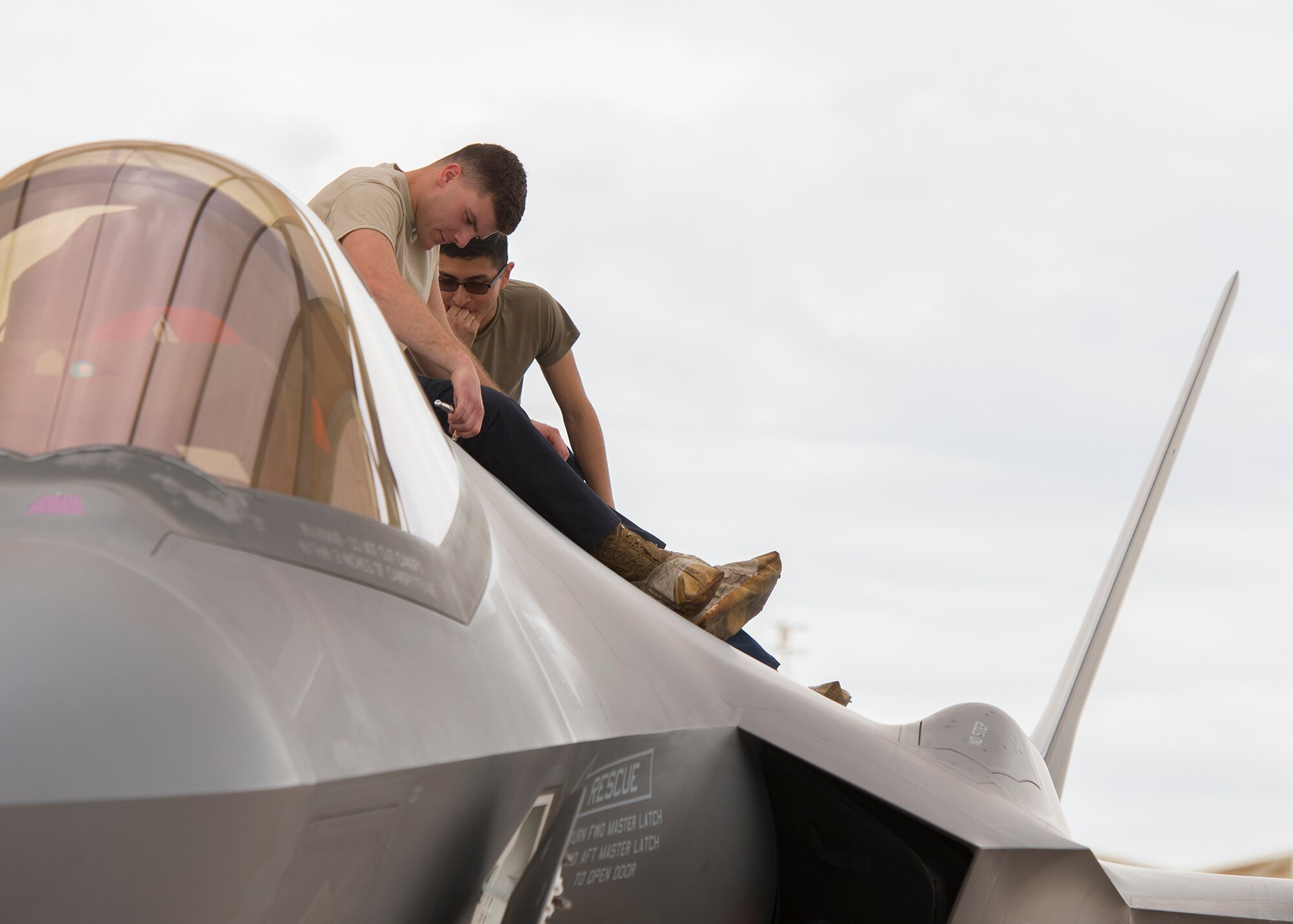 Senior Airman Brenden Hansen, 56th Component Maintenance Squadron maintainer, and Airman 1st Class Christian Cervantes, 63rd Aircraft Maintenance Unit maintainer, evaluate an F-35A Lightning II to ensure it is mission capable, March 10, 2020, at Luke Air Force Base, Ariz.