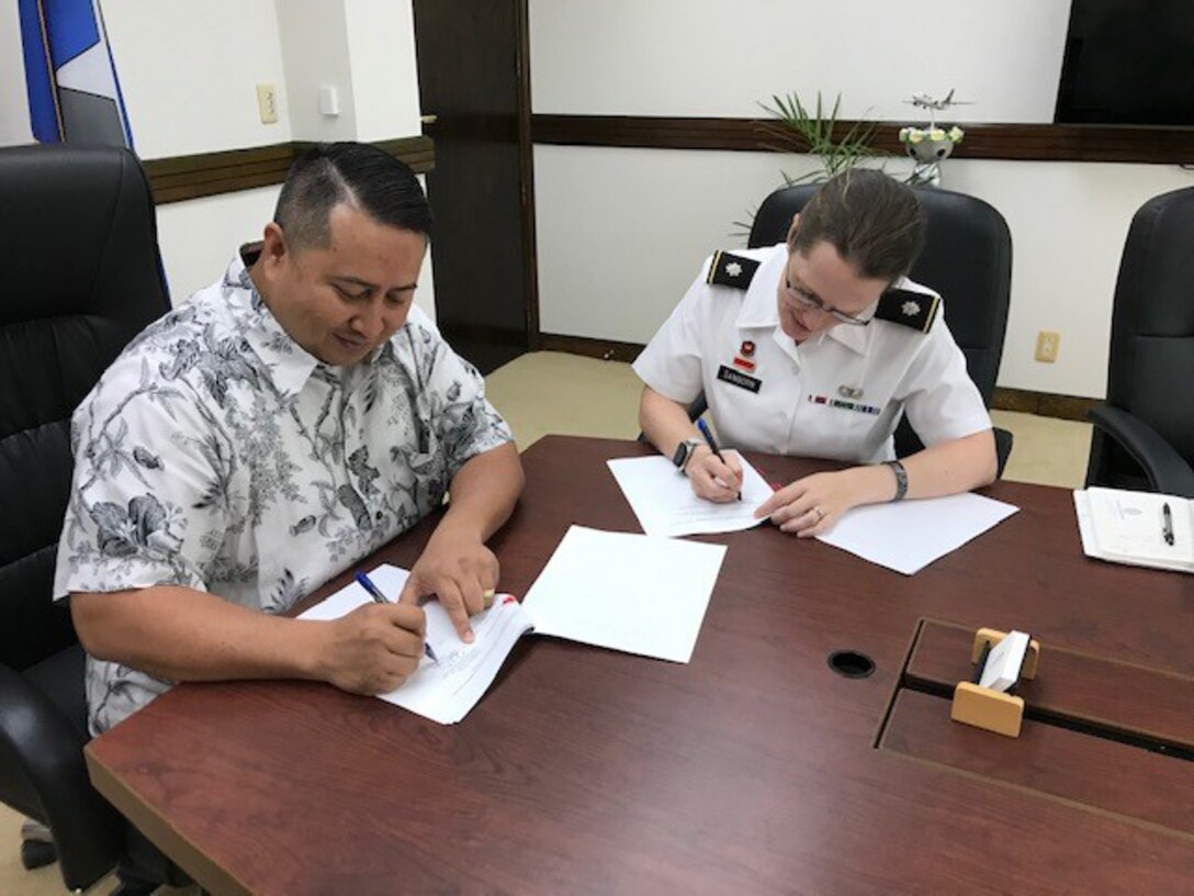 CAPITAL HILL, SAIPAN (MARCH 9, 2020) -- U.S. Army Corps of Engineers Honolulu District Commander Lt. Col. Kathryn Sanborn and Saipan Gov. Ralph Torres sign the Feasibility Cost-Share Agreement (FCSA) for the Saipan Beach Road Coastal Storm Damage Reduction Study.