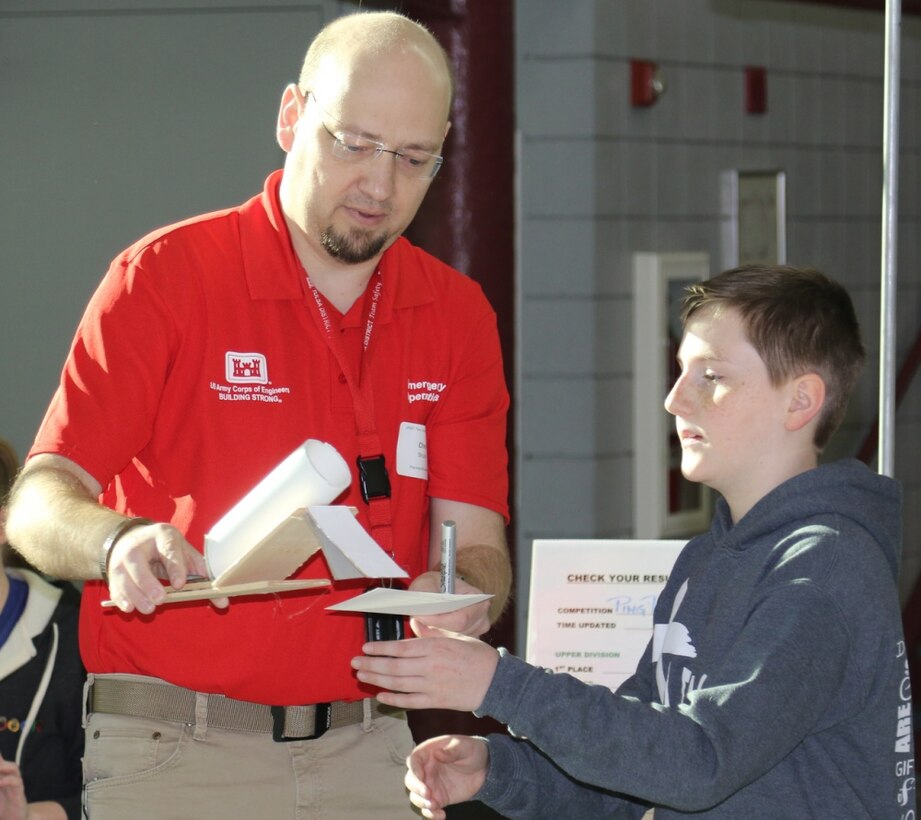 Christopher Strunk, chief of military design, Tulsa District, U.S. Army Corps of Engineers reviews a ping pong ball launcher submission entry during the 2020 Tulsa Engineering Challenge at Tulsa Technical Institue, March
