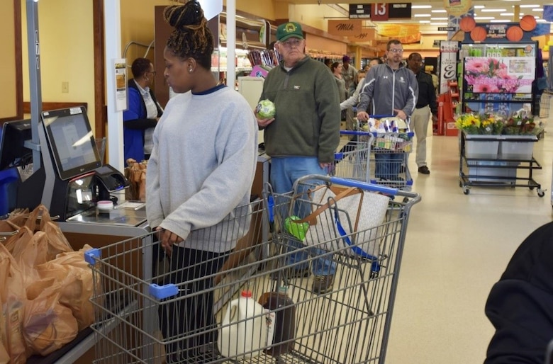 Shoppers at the Fort Lee, Virginia, Commissary, use the self-checkout lanes at the store. (Defense Commissary Agency photo by Mike Cerny)