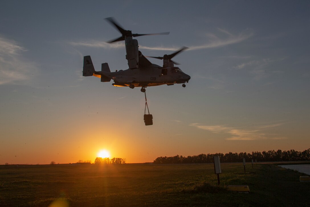 An aircraft carries cargo.