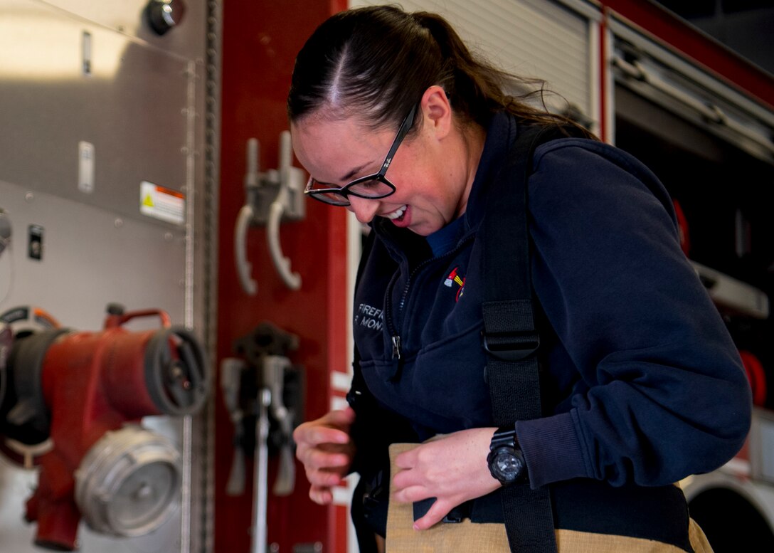 Firefighter gears up.
