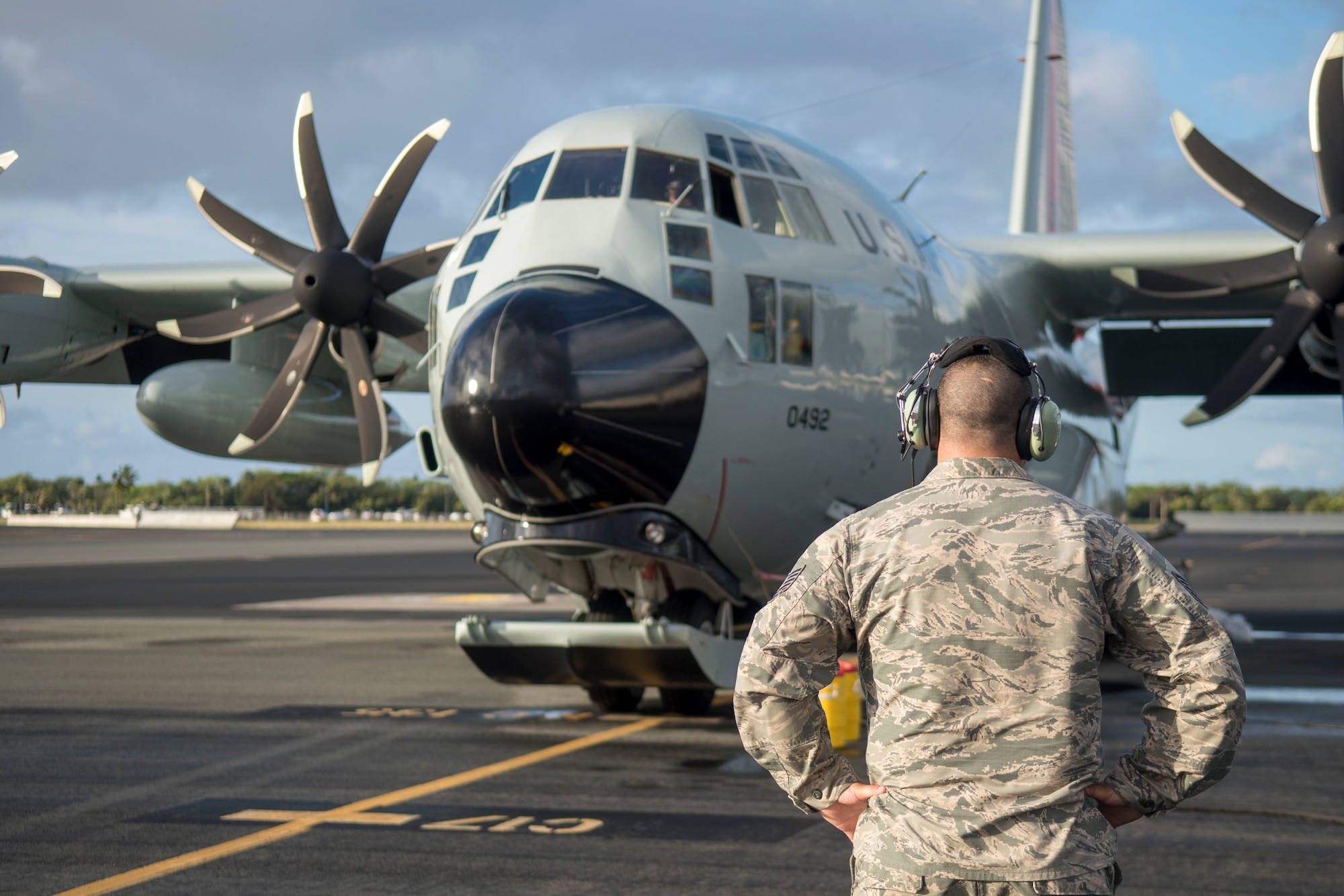 An Airman assigned to the 109th Airlift Wing, Stratton Air National Guard Base, New York, performs pre-flight inspections on an LC-130 Hercules on the flightline at Joint Base Pearl Harbor-Hickam, Hawaii, March 7, 2020. The crew was supporting Operation DEEP FREEZE.  U.S. Indo-Pacific Command assumed logistical support for the U.S. Antarctic Program from U.S. Transportation Command on March 1, 2005. (U.S. Air Force photo by Staff Sgt. Mikaley Kline)