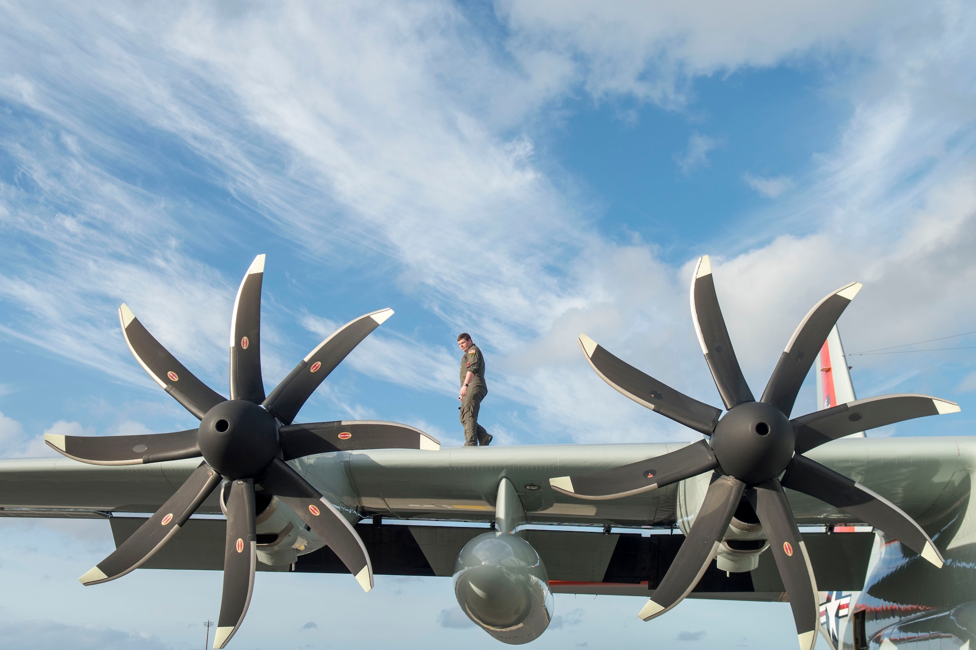 An Airman assigned to the 109th Airlift Wing, Stratton Air National Guard Base, New York, performs pre-flight inspections on an LC-130 Hercules on the flightline at Joint Base Pearl Harbor-Hickam, Hawaii, March 7, 2020. The crew was supporting Operation DEEP FREEZE. Due to Antarctica’s austere environment, Operation DEEP FREEZE is one of the most difficult peacetime missions the U.S military conducts. (U.S. Air Force photo by Staff Sgt. Mikaley Kline)