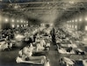 Soldiers at Camp Funston, Kansas, are quarantined while recovering from the Spanish flu in 1918. The flu infected about 500 million people around the world.