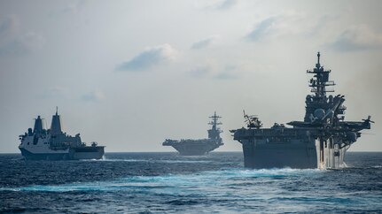 SOUTH CHINA SEA (March 15, 2020) Ships from the Theodore Roosevelt Carrier Strike Group and the America Expeditionary Strike Group transit the South China Sea, March 15, 2020.  Operating as an expeditionary strike force, the Navy-Marine Corps team integrates the combat power of the Theodore Roosevelt Carrier Strike Group with the flexible capability of the America Expeditionary Strike Group and 31st Marine Expeditionary Unit to provide the fleet commander with a capable, credible combat force that can be deployed anywhere in the world.
