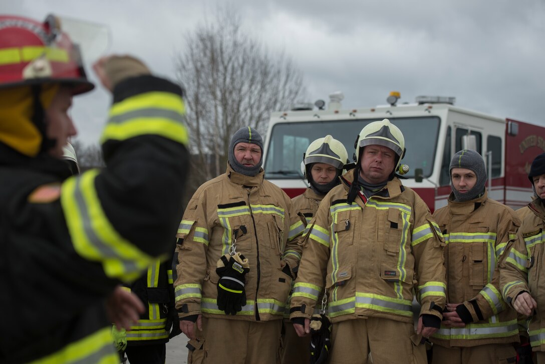 Photo of firefighters waiting for instruction.