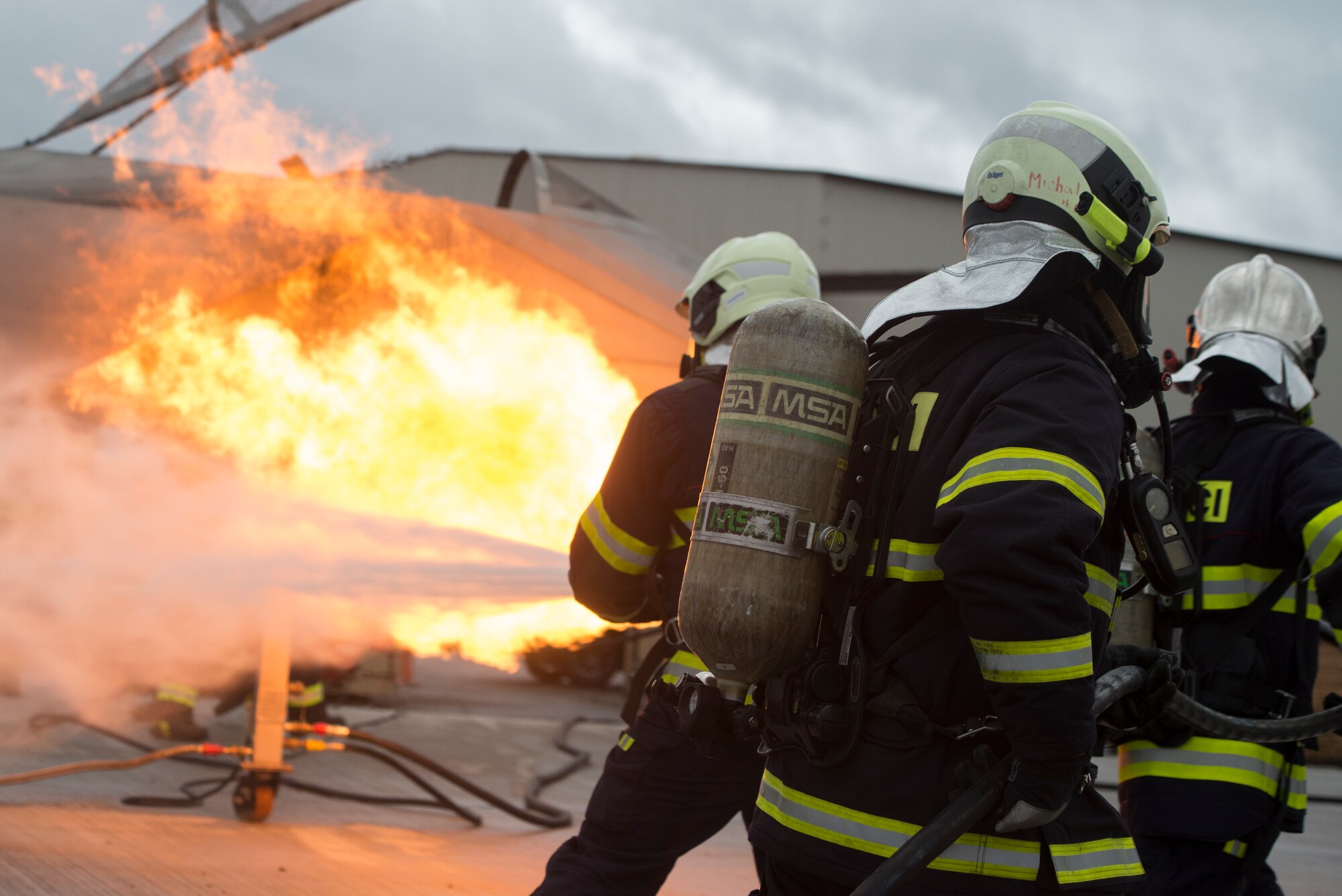Photo of firefighters extinguishing flames.