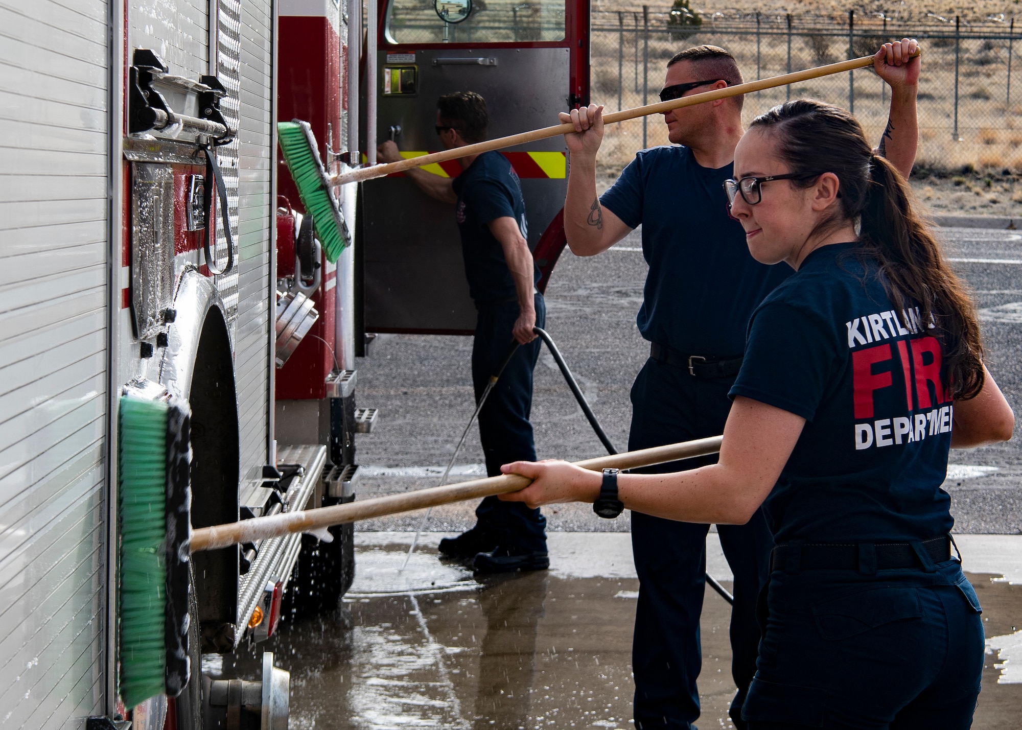 Firefighters wash the firetruck