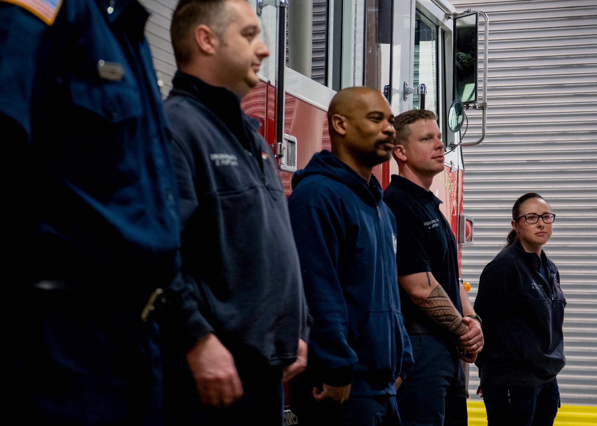 Firefighters receive daily briefing.