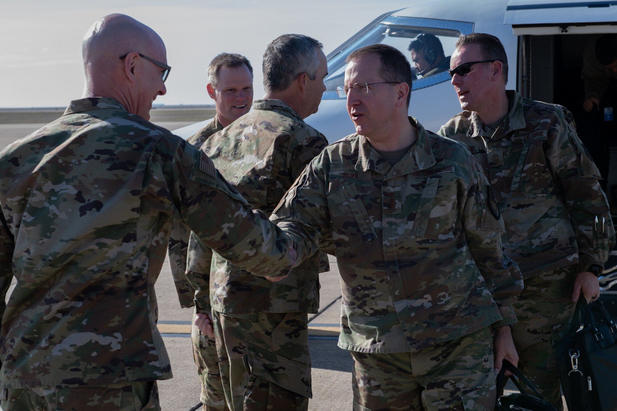 Chief Master Sgt. Brian A. Brindle, 137th Special Operations Wing command chief master sergeant, welcomes U.S. Air Force Lt. Gen. Jim Slife, commander of Air Force Special Operations Command (AFSOC), Hurlburt Field, Fla., to Will Rogers Air National Guard Base (WRANGB) in Oklahoma City, March 7, 2020. Slife and Command Chief Master Sgt. Cory M. Olson, AFSOC command chief master sergeant, visited WRANGB for an immersion visit that included a base tour and seeing firsthand the contributions that the 137th SOW makes to the special operations community. (U.S. Air National Guard photo by Senior Master Sgt. Andrew M. LaMoreaux)