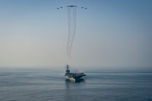The aircraft carrier USS Dwight D. Eisenhower (CVN 69) conducts a combined air wing operation with a B-52 Bomber from U.S. Air Forces Central Command in the Arabian Sea, March 18, 2020. Ike is deployed to the U.S. 5th Fleet area of operations in support of naval operations to ensure maritime stability and security in the Central Region, connecting the Mediterranean and Pacific through the Western Indian Ocean and three strategic choke points.