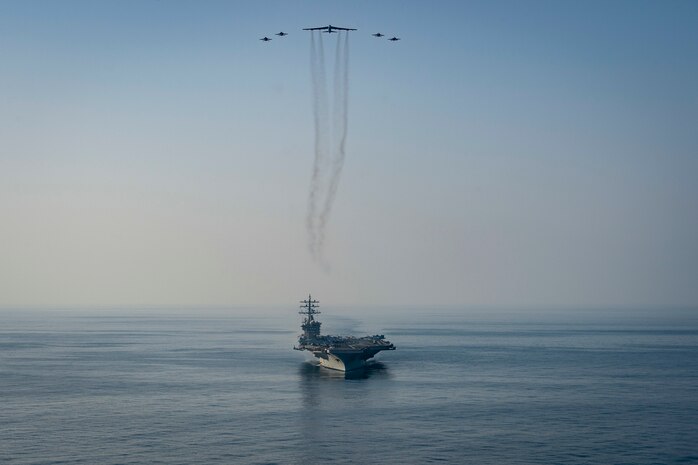 The aircraft carrier USS Dwight D. Eisenhower (CVN 69) conducts a combined air wing operation with a B-52 Bomber from U.S. Air Forces Central Command in the Arabian Sea, March 18, 2020. Ike is deployed to the U.S. 5th Fleet area of operations in support of naval operations to ensure maritime stability and security in the Central Region, connecting the Mediterranean and Pacific through the Western Indian Ocean and three strategic choke points.