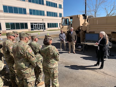 Shannon Marion, right, with AMCOM's Publication Services Division, demonstrates to AMCOM 101 for Missiles participants how the AMCOM-developed Interactive Authoring and Display Software interfaces with the Combat Capabilities Development Command (CCDC) Aviation & Missile Center (AvMC) Diagnostic Software for Missile Carrier Systems.