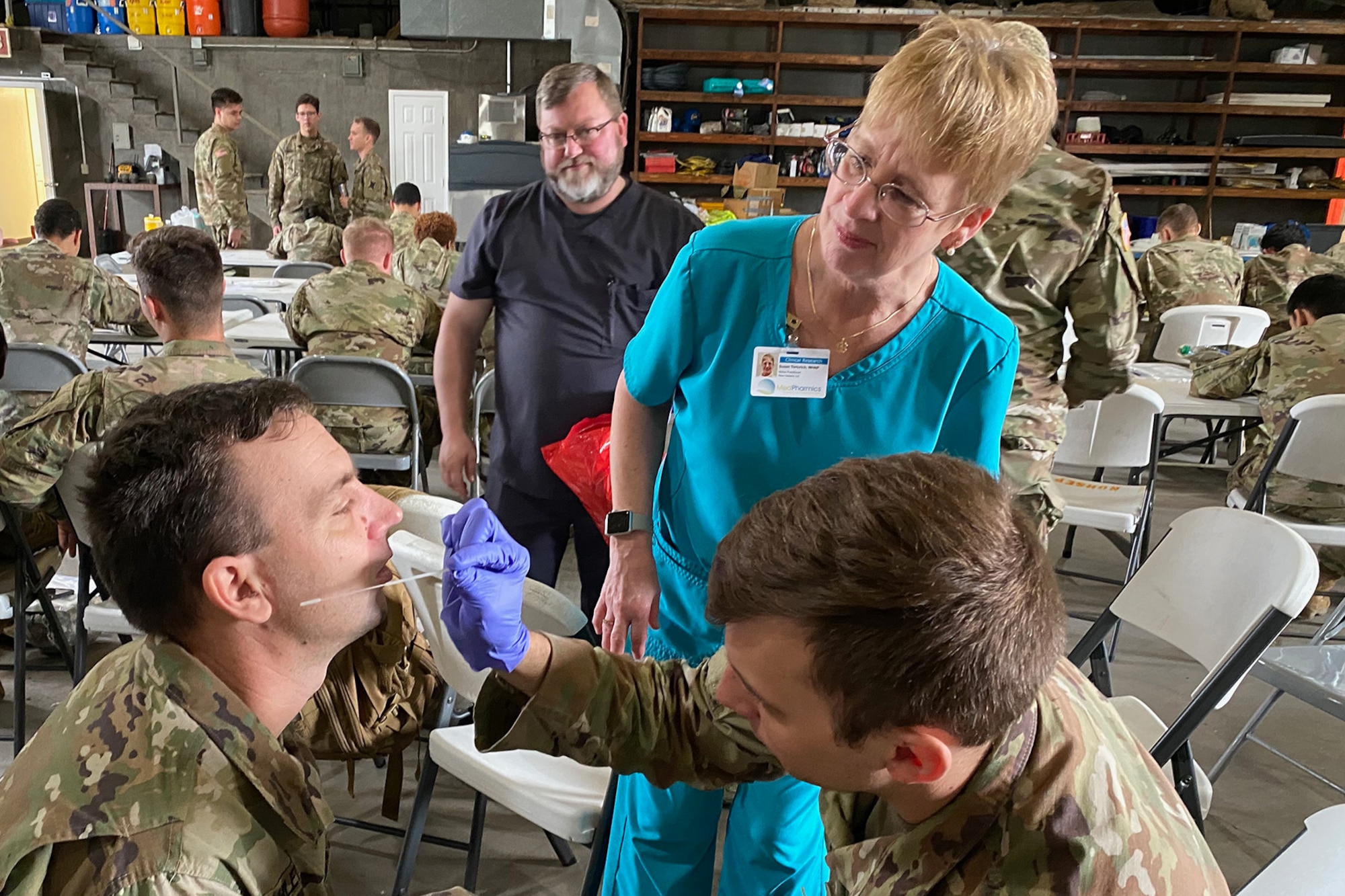 Louisiana National Guard medics, from both the Air and Army, conduct training with the Department of Health and Human Services to ensure proper protection and administration of test kits occurs during drive-thru testing, March 18, 2020, in New Orleans. (Photo by Maj. John Meche)