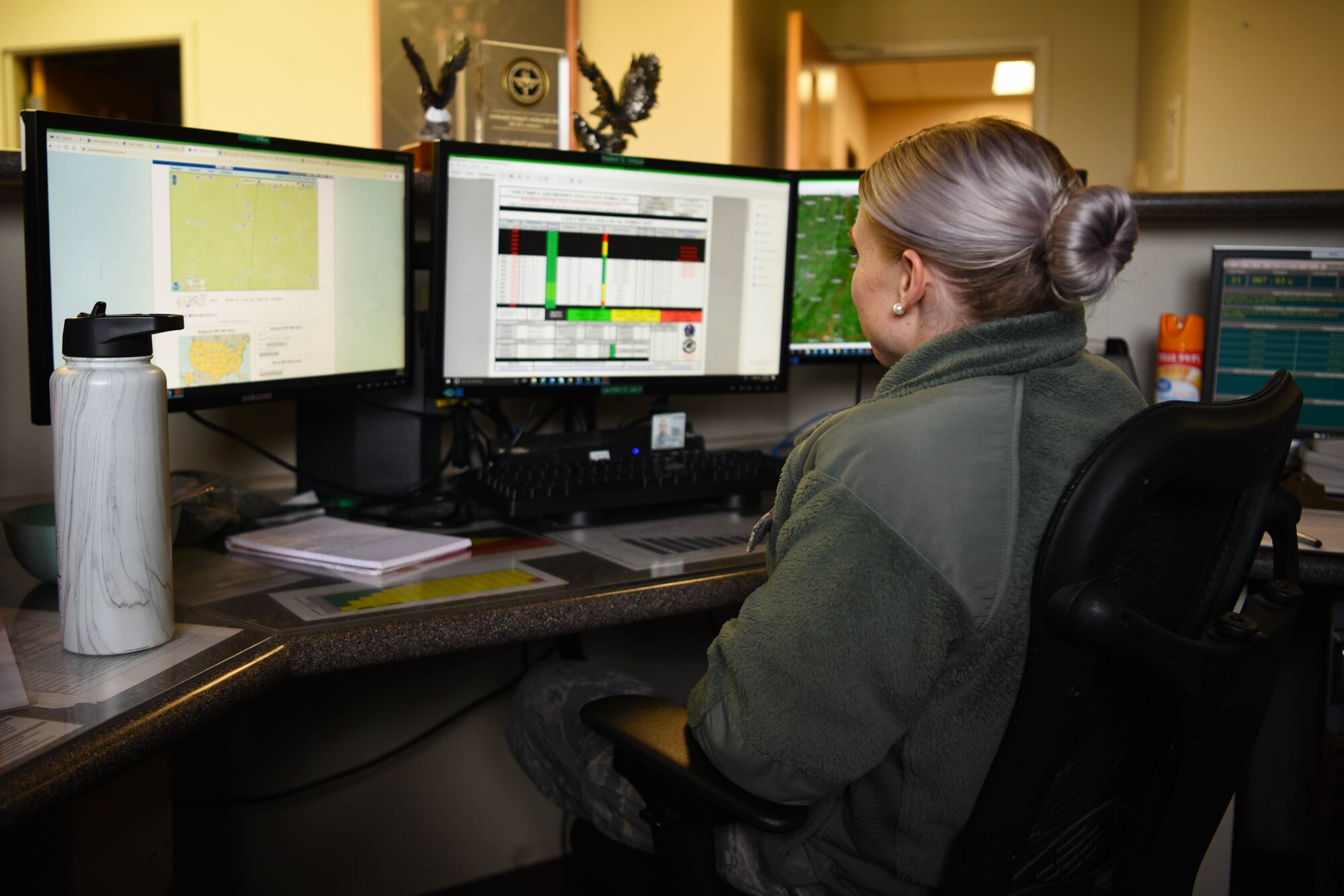 Senior Airman Lauren Rodgers, 14th Operations Support Squadron Weather Flight journeymen, updates and distributes weather information March 16, 2020, on Columbus Air Force Base, Miss. Weather Flight personnel are either on-duty or on-call at all hours to ensure that the base is forewarned when severe weather is likely to occur. (U.S. Air Force photo by Airman 1st Class Jake Jacobsen)