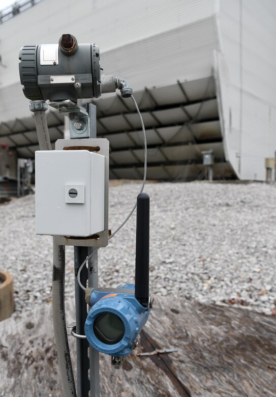 A wireless transmitter, bottom, connected to an existing wired instrument, top, provides a wireless connection to the Condition-Based Maintenance network, seen here Feb. 11, 2020, at Arnold Air Force Base, Tenn. Consolidating data with the use of monitoring and diagnostic software allows for improved decision-making. (U.S. Air Force photo by Jill Pickett) (This image has been altered by obscuring items for security purposes.)