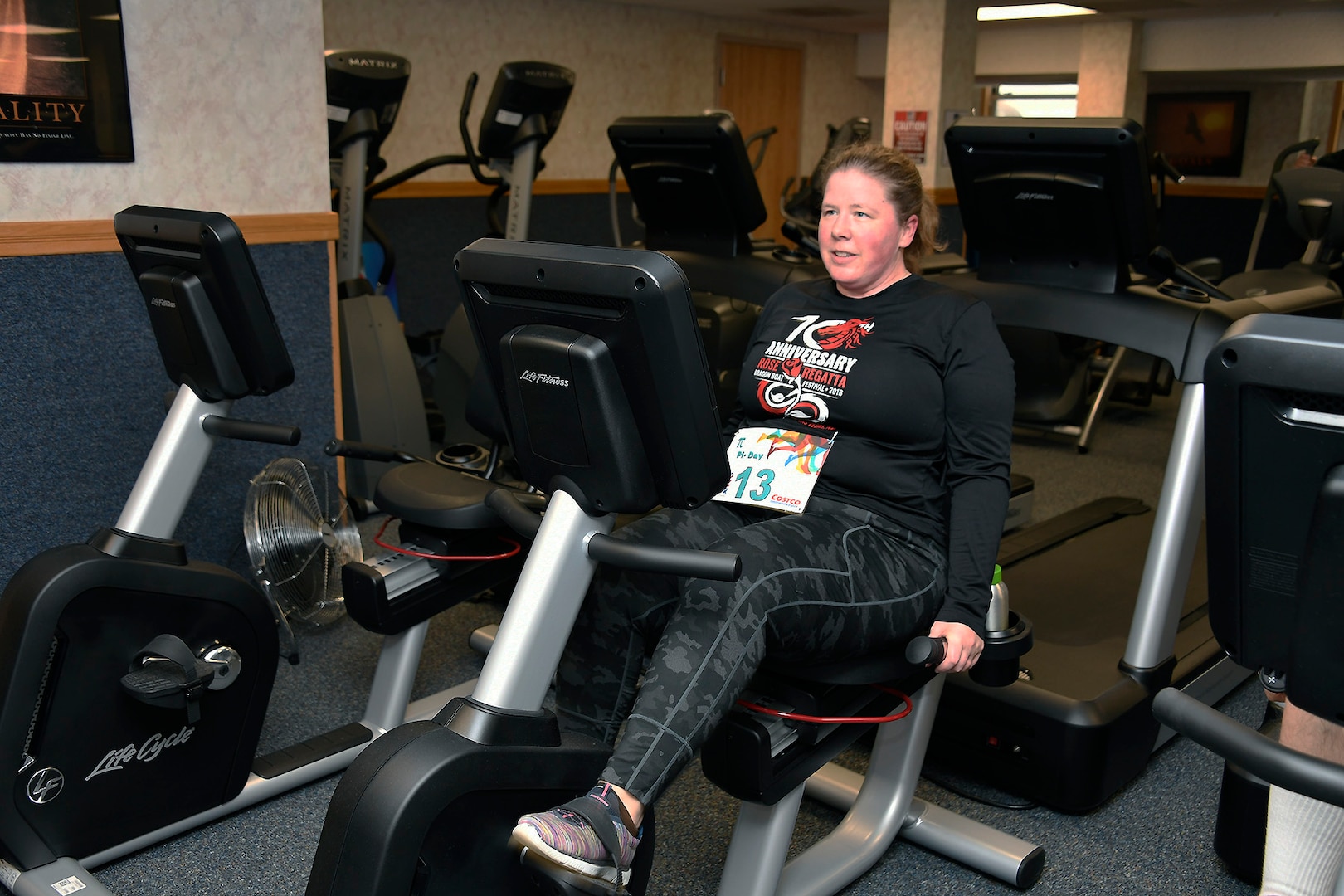Melissa Smith pedals away on the recumbent bike during the Pi Day observance March 11.