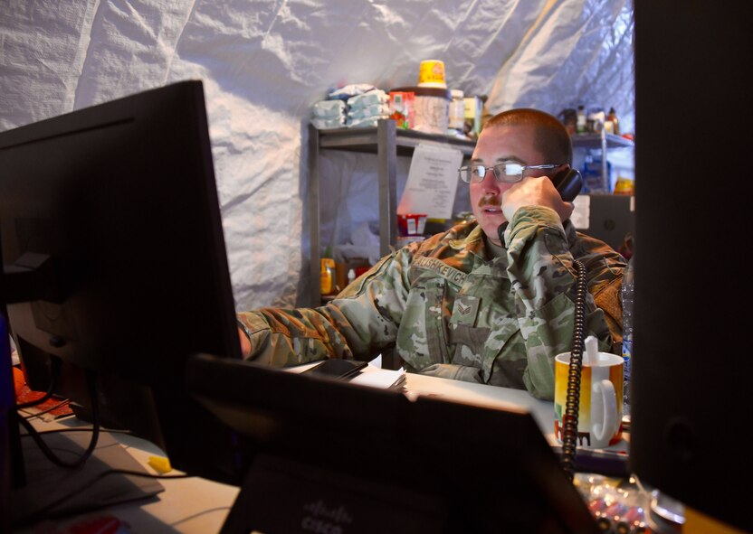 U.S. Air Force Senior Airman Rodion Alashkevich, 378 Expeditionary Contracting Squadron contracting specialist, coordinates a purchase for a construction project on Prince Sultan Air Base, Kingdom of Saudi Arabia, Mach 10, 2020. Members of the 378 ECONS are responsible for soliciting and acquiring the services and materials needed for most construction projects and services on PSAB. (U.S. Air Force by Tech. Sgt. Michael Charles)