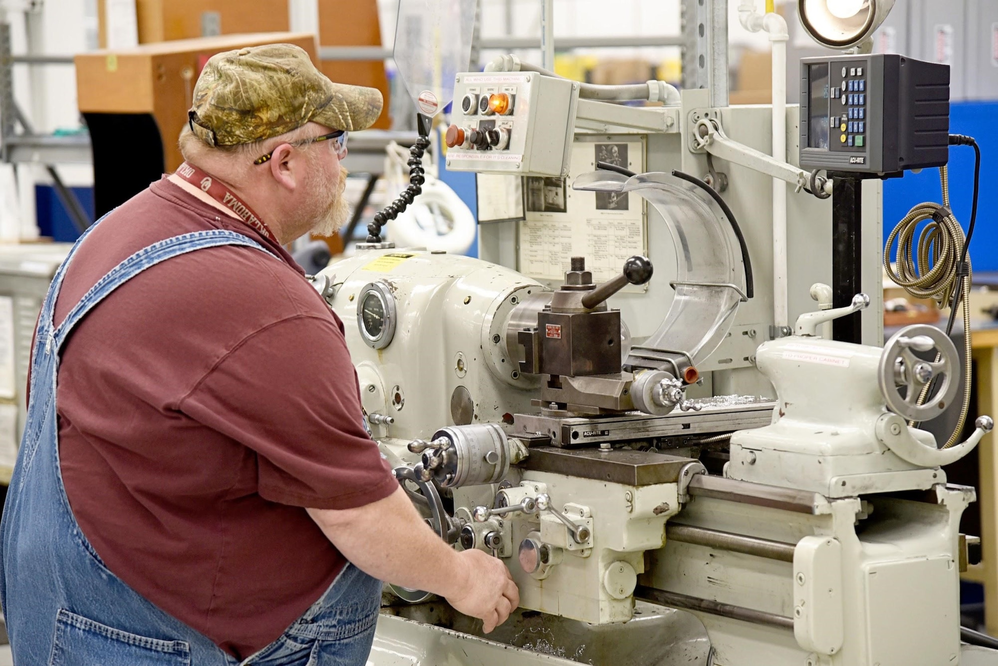Rick Warner machines a part for a constant speed drive, which is a part of the tear-down and disassembly portion of the CSD Shop's process flow. If a CSD is determined to receive a full overhaul, it goes through machining, paint stripping and non-destructive inspection processes before moving on to kitting and assembly. (U.S. Air Force photo/Kelly White)