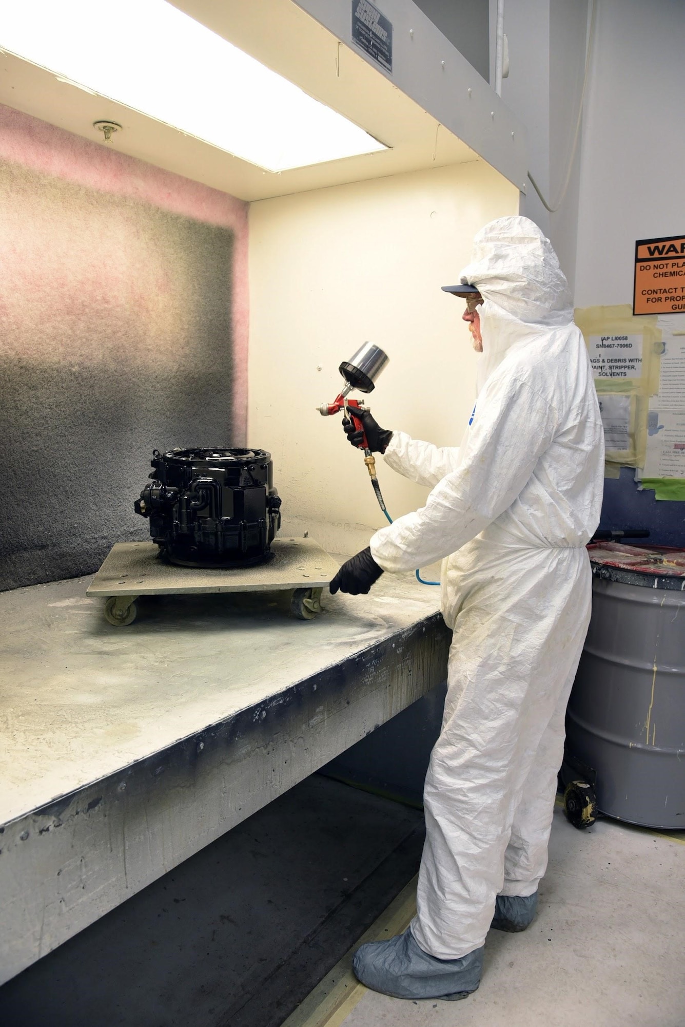 After a constant speed drive has passed leak checks and testing, it moves on to receive a final coat of paint (shown here, by Chuck Pollard, 552nd Commodities Maintenance Squadron), which will ready the part for sale. The CSD Shop is unique to the Air Force, with a total crew of 73 individuals working various aspects of its overhaul process, which has recently undergone a significant process improvement by reducing their flow days and saving millions in material costs. (U.S. Air Force photo/Kelly White)