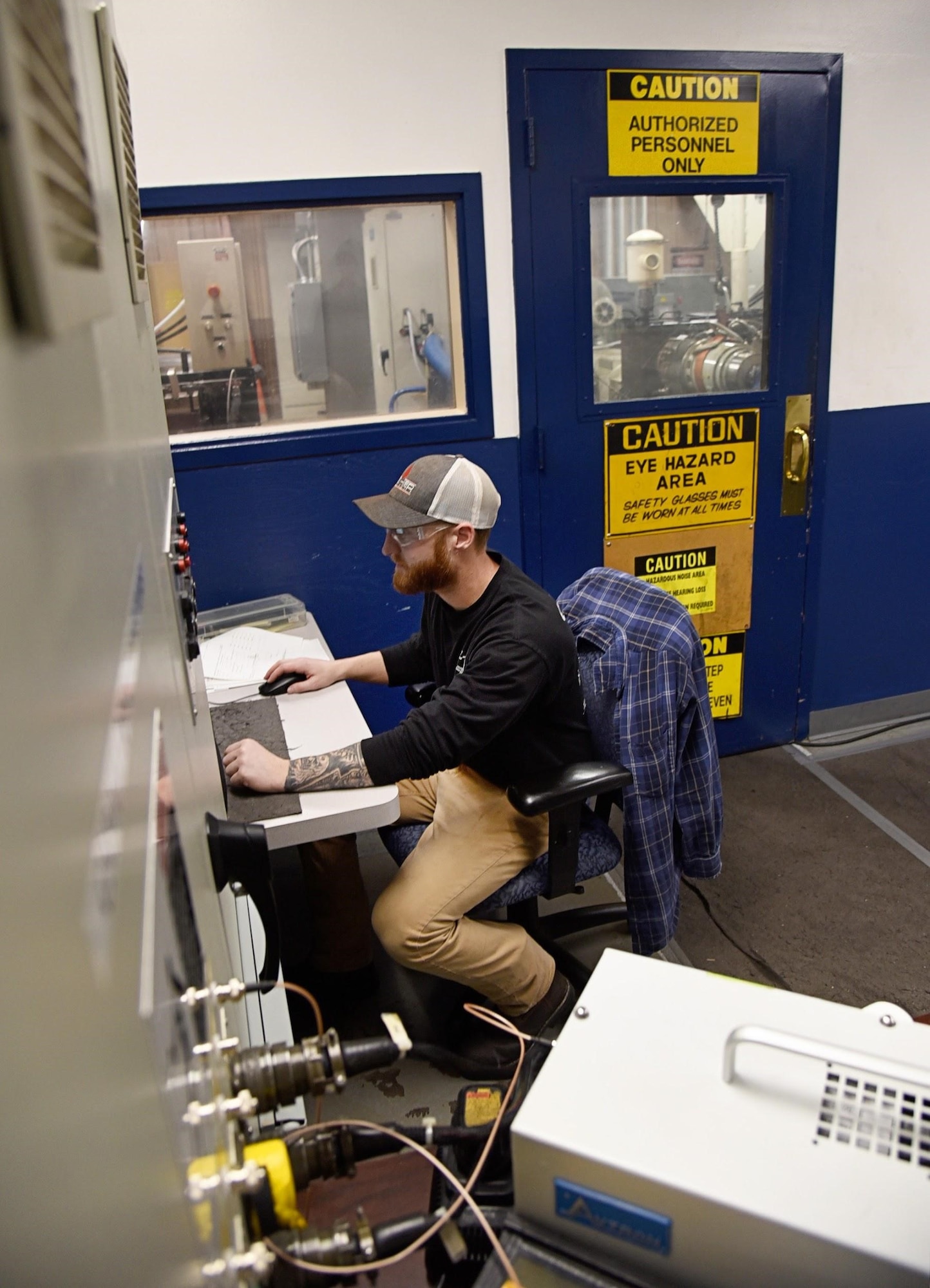 Chad Burnett, a pneudraulic systems mechanic with the 552nd Commodities Maintenance Squadron, performs leak checks and testing on constant speed drives. If the CSD passes, it will go on to be painted and sold to the customer. (U.S. Air Force photo/Kelly White)
