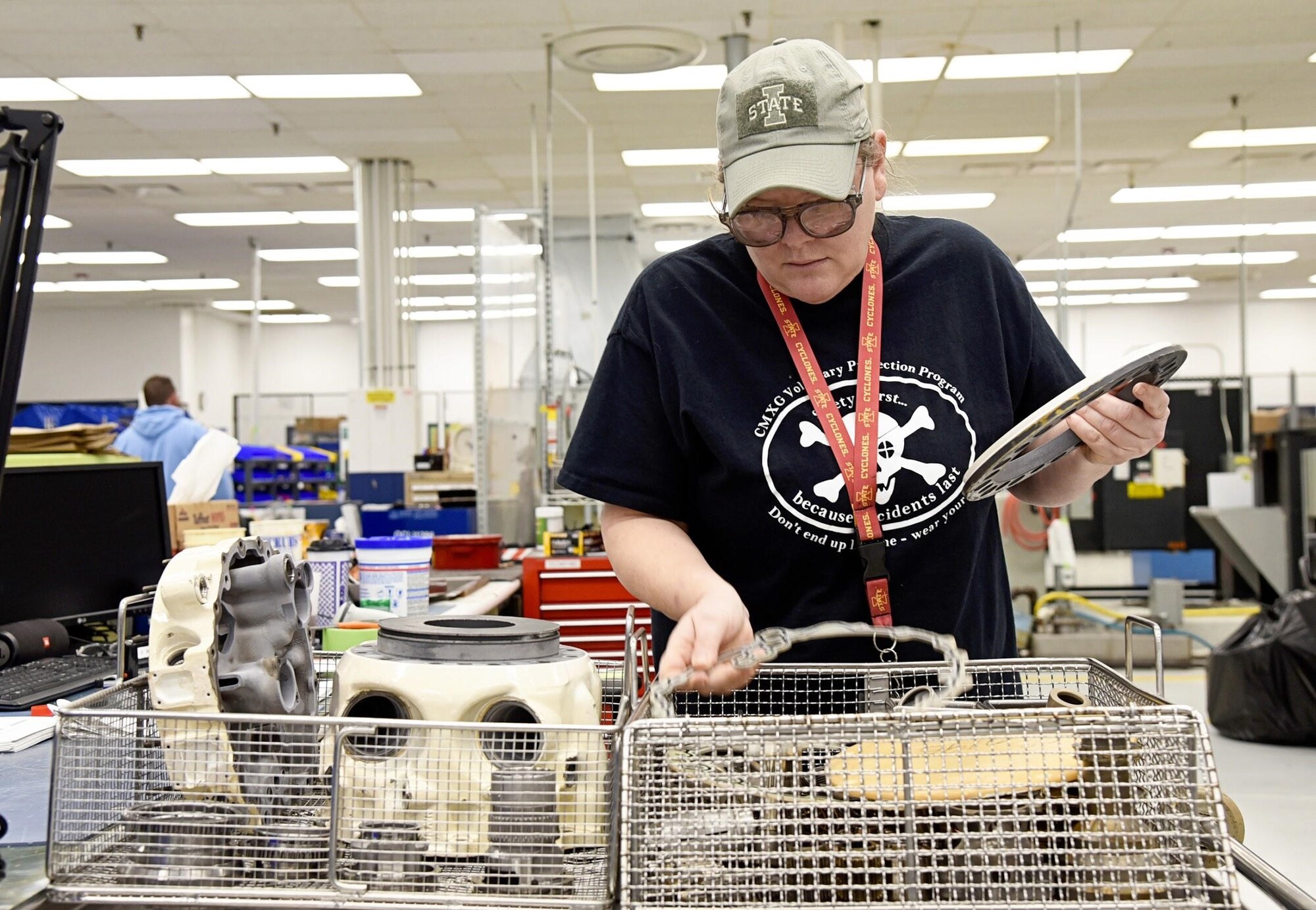 Deanne Baker works as a detailed inspector for the 552nd Commodities Maintenance Squadron. In the tear-down portion of the Constant Speed Drive Shop's overhaul process flow, Baker breaks down the components, sends them through a wash and clean line, and then will inspect them for corrosion, galling and chipped parts. The CSD Shop has significantly reduced their flow days by determining which CSDs will undergo an evaluated overhaul or a more extensive overhaul depending on part failures in the evaluation. (U.S. Air Force photo/Kelly White)