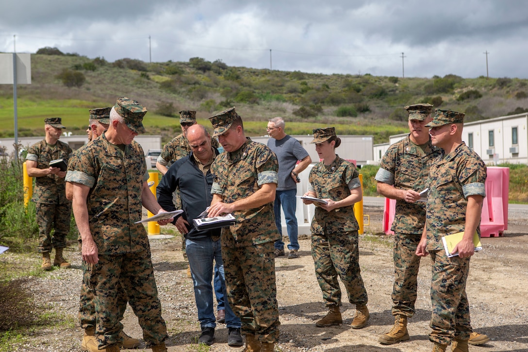 A U.S. Marine briefs Brig. Gen. Dan Conley at the medial isolation and observation center being set up near the 13 Area on Camp Pendleton, California, March 15.