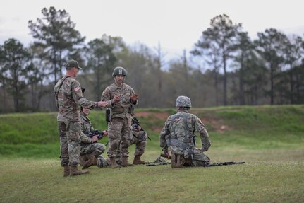 Team Coach Sgt. 1st Class Rosendorn instructs the 3-335th TSBn Soldiers prior to a stage of fire. "Team Blackhawks" took first place among the other Army Reserve teams.