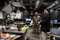 Eliot Winer, director of Iowa State University (ISU) Virtual Reality Applications Center (VRAC), gives U.S. Navy Adm. Charles Richard, commander of U.S. Strategic Command (USSTRATCOM), at tour of the VRAC’s Design and Build Lab in Ames, Iowa, March 12, 2020. Richard attended the 2020 Deterrence and Assurance Academic Alliance Conference, a two-day conference featuring a USSTRATCOM-led tabletop exercise focused on deterrence issues, along with student panel presentations, tours and demonstrations, a national security job fair.