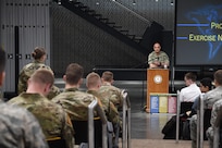 An Iowa State University ROTC cadet asks U.S. Navy Adm. Charles Richard, commander of U.S. Strategic Command (USSTRATCOM), a question during the 2020 Deterrence and Assurance Academic Alliance Conference in Ames, Iowa, March 12, 2020. Over 100 participants attended the two-day event, themed Deterrence: Theory to Application, A Cyclone of Challenges. The event featured student panel presentations, tours and demonstrations, a national security job fair, and a four-hour USSTRATCOM-led tabletop exercise, which simulated a strategic level national security crisis to test their analytic expertise.