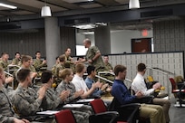 An Iowa State University ROTC cadet receives a command coin from U.S. Navy Adm. Charles Richard, commander of U.S. Strategic Command (USSTRATCOM), during the 2020 Deterrence and Assurance Academic Alliance Conference in Ames, Iowa, March 12, 2020. Over 100 participants attended the two-day event, themed Deterrence: Theory to Application, A Cyclone of Challenges. The event featured student panel presentations, tours and demonstrations, a national security job fair, and a four-hour USSTRATCOM-led tabletop exercise, which simulated a strategic level national security crisis to test their analytic expertise.
