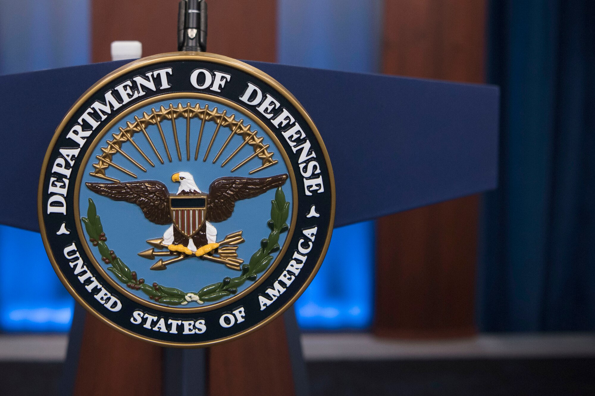 The Defense Department seal adorns a lectern in the Pentagon Briefing Room.
