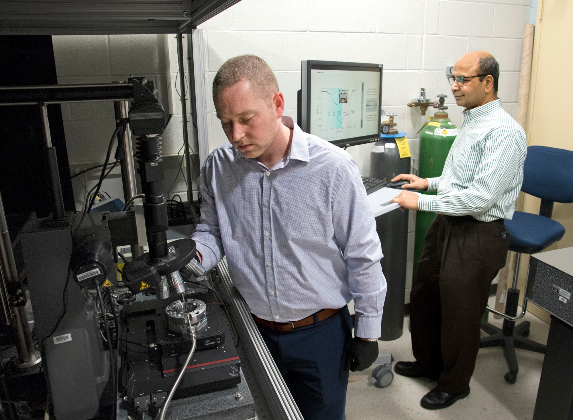 Researchers Dr. Nicholas Glavin (left) and Dr. Ajit Roy are working to develop flexible, wearable toxic agent detectors.