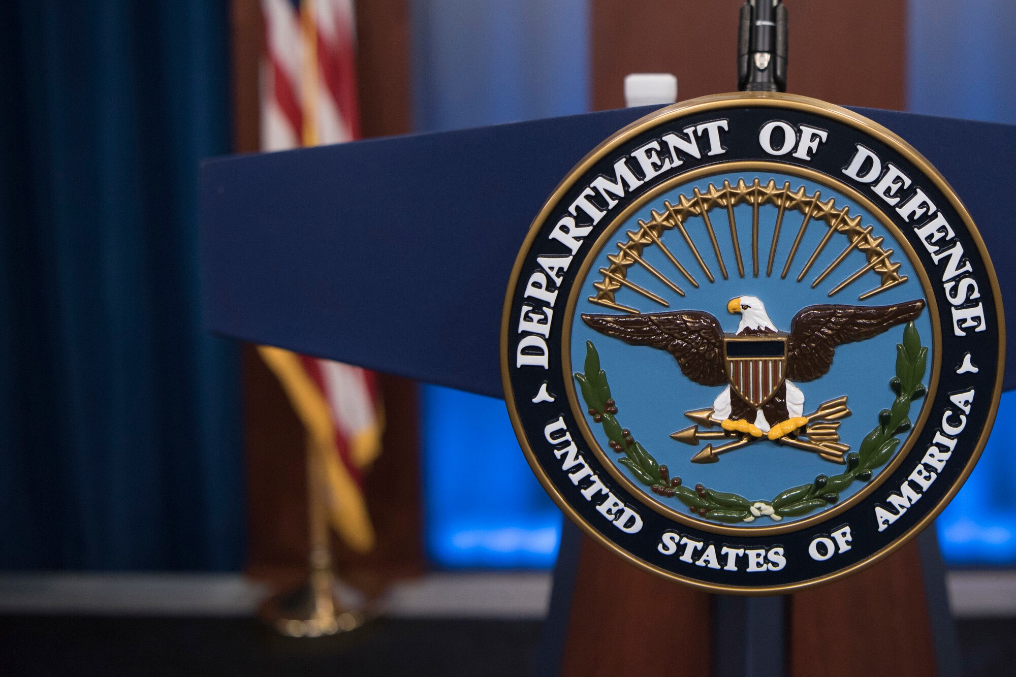 The Defense Department seal adorns a lectern in the Pentagon Briefing Room.