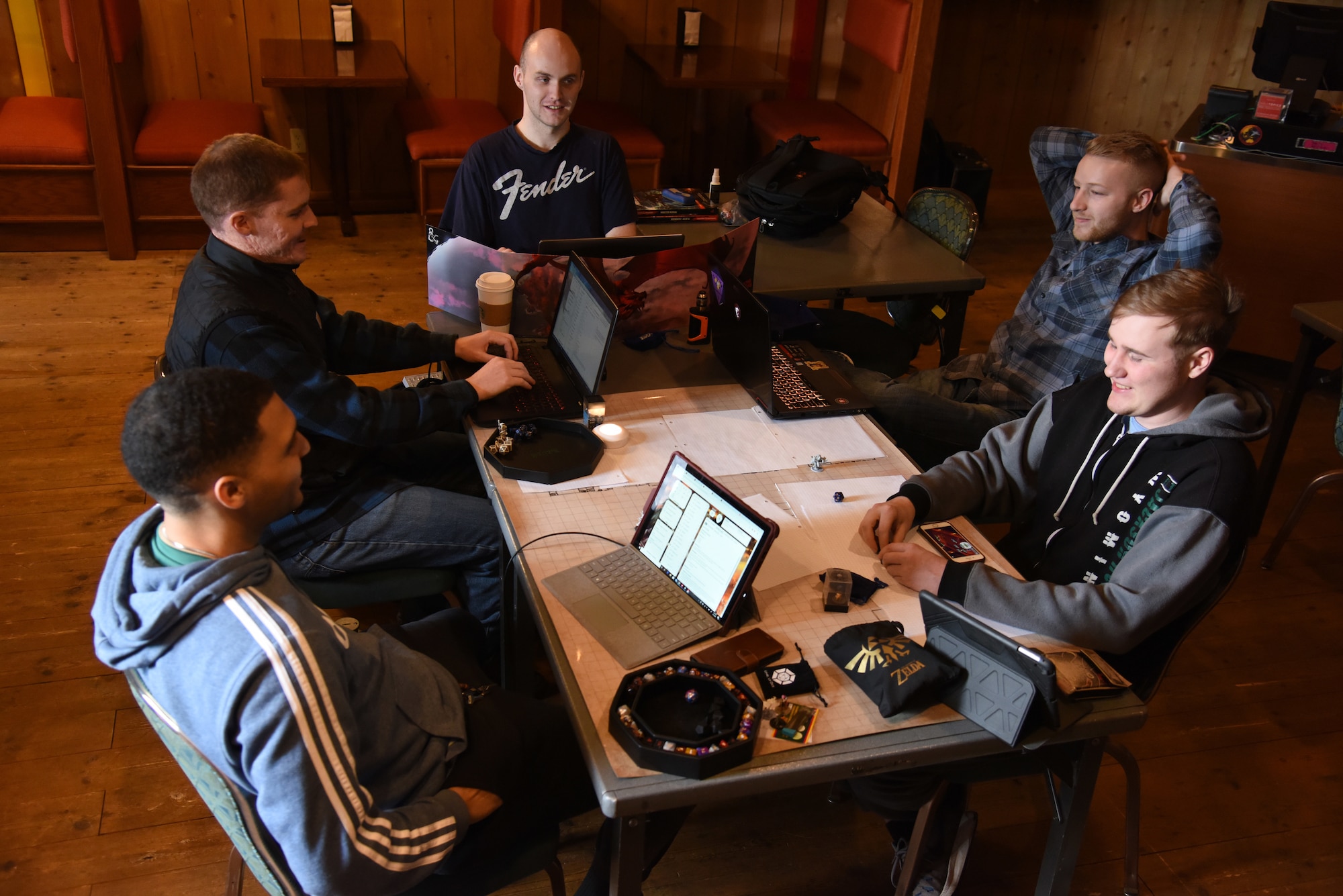 U.S. Airmen from the 35th Fighter Wing, Misawa Air Base, Japan, gather to play a tabletop role-playing game, March 7, 2020.  The Toppers gaming club meets every Saturday at T’s Burritos in the Enlisted Club. The club provided the opportunity for gaming enthusiasts to be a part of a community where Airmen share similar interests in tabletop games. (U.S. Air Force photo by Tech. Sgt. Chris Jacobs)