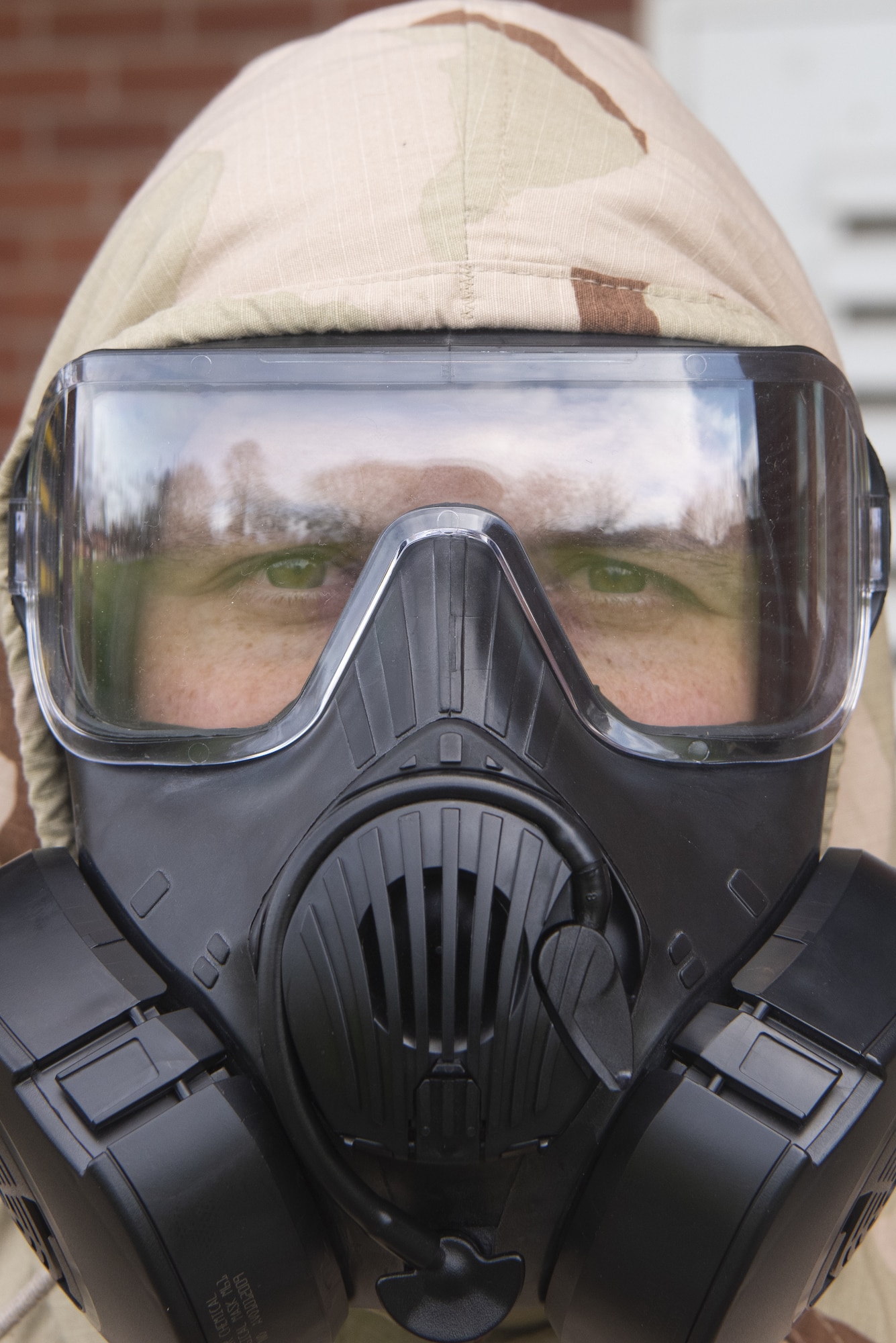 Airman 1st Class Kamron Karnes, 100th Maintenance Squadron Aerospace Ground Equipment apprentice, poses for a photo in his M50 gas mask March 17, 2020, at RAF Mildenhall, England. Emergency management Airmen are responsible for ensuring Airmen like Karnes have the skills needed to operate their chemical, biological, radiological and nuclear protective gear. (U.S. Air Force photo by Airman 1st Class Joseph Barron)