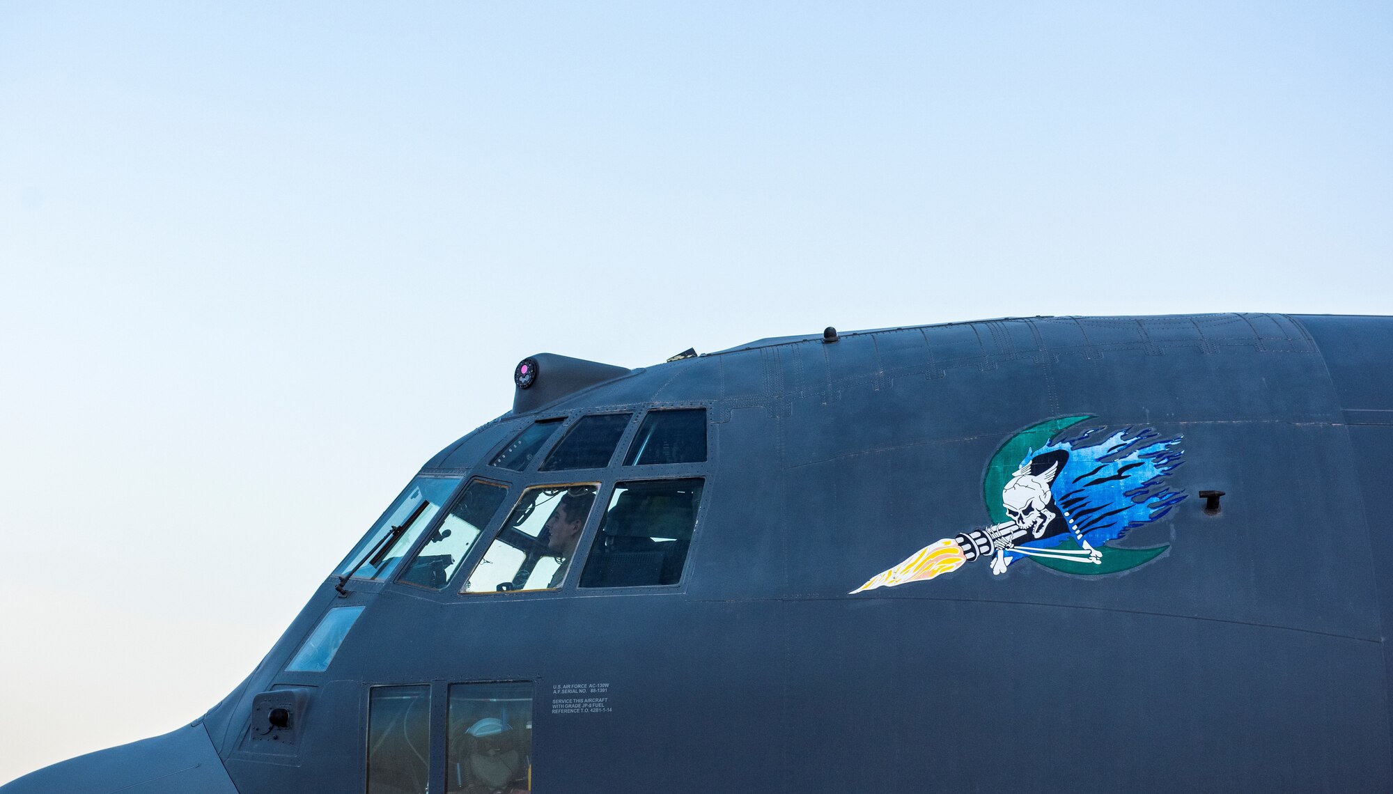 A person sits inside a cockpit