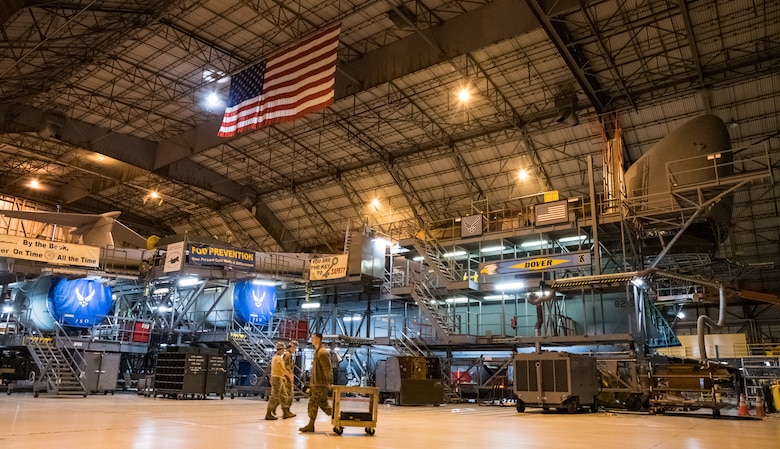 A C-5M Super Galaxy undergoes an isochronal inspection by 436th Maintenance Squadron aircraft maintenance personnel at the C-5 Isochronal Inspection Dock at Dover Air Force Base, Del., March 17, 2020. To help mitigate the spread of COVID-19, Airmen practiced social distancing as much as possible while performing maintenance on the aircraft. (U.S. Air Force photo by Roland Balik)