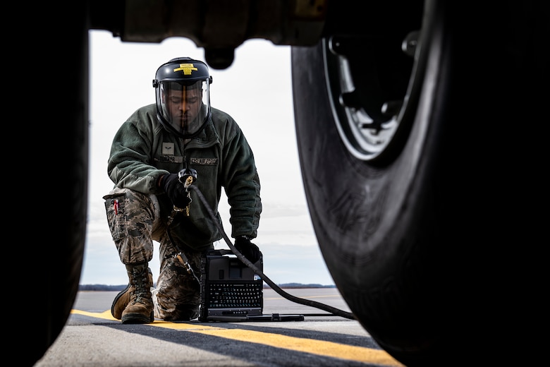 Airman 1st Class Elijah Turner, 911th Aircraft Maintenance Squadron crew chief, services a C-17 Globemaster III tire at the Pittsburgh International Airport Air Reserve Station, Pa., March 18, 2020. Crew chiefs perform a variety of tasks while working on the aircraft to ensure mission and operational readiness. (U.S. Air Force photo by Joshua J. Seybert)