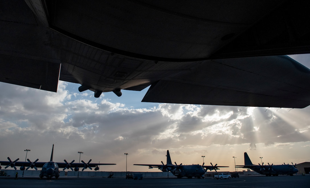 MC-130H Combat Talon IIs and AC-130W Stinger IIs park on the flightline of Ali Al Salem Air Base, Kuwait, March 14, 2020. The MC-130 and AC-130 are variants of the C-130 and have wide skill sets that can lend themselves to a variety of missions. (U.S. Air Force photo by Senior Airman Kevin Tanenbaum)