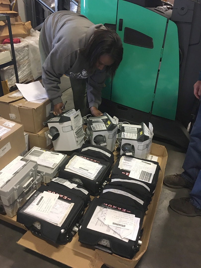 Property Disposal Specialist Keneicsha Monroe examines some ventilators at the DLA Disposition Services site at Fort Bragg, North Carolina. Monroe and other specialists at all DLA Disposition Services sites having been working to locate high demand medical supplies and equipment in the excess property inventory to have items ready for reutilization, transfer and donation requisitions in support of the COVID-19 response.