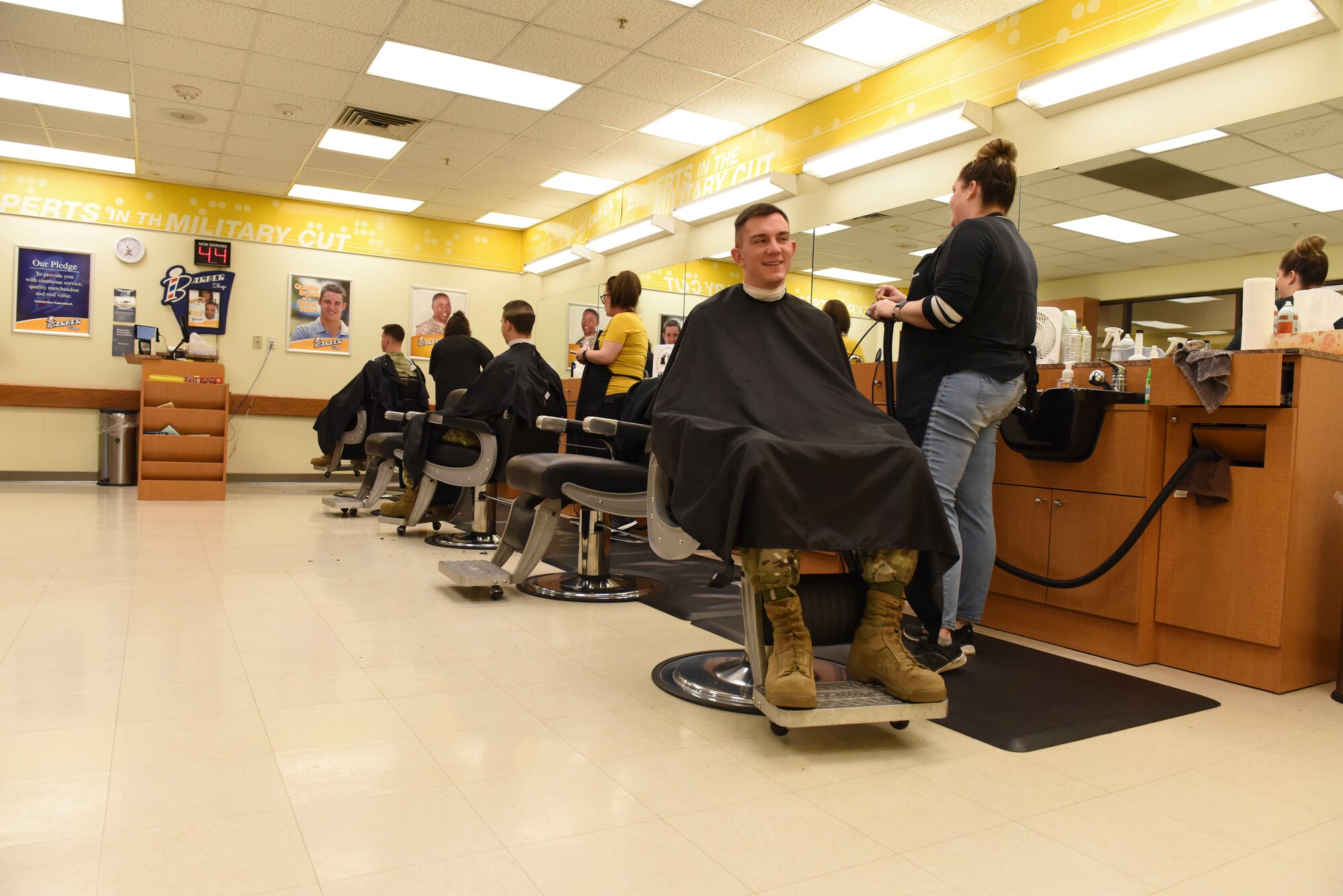 The Whiteman Barbershop practices safe distancing by seating customers three to six feet of each other at Whiteman Air Force Base, Missouri, March 19,2020. The Whiteman Barbershop cleans and wipes down all seats and cash machines after every customer (U.S. Air Force photo by Senior Airman Alexandria Lee)