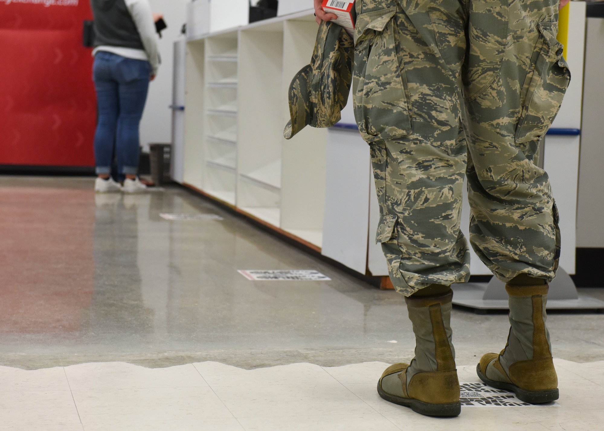 Customers shopping at Whiteman Air Force Base Exchange are keeping a safe distance from each other at Whiteman Air Force Base, Missouri, March 19,2020.  Whiteman Air Force Base Exchange posted signage all throughout the store to inform customers of how to keep a proper safe distance. (U.S. Air Force photo by Senior Airman Alexandria Lee)